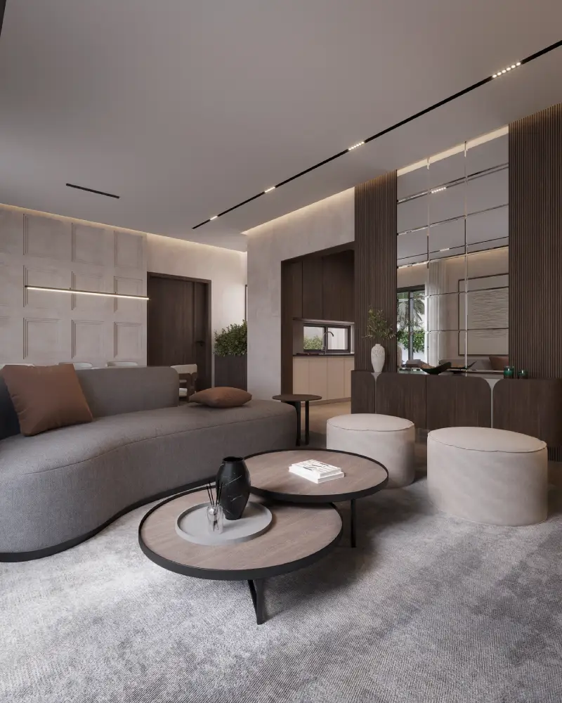 Residential interior by BloxDot, Lahore living room with curved sofa and warm material palette.