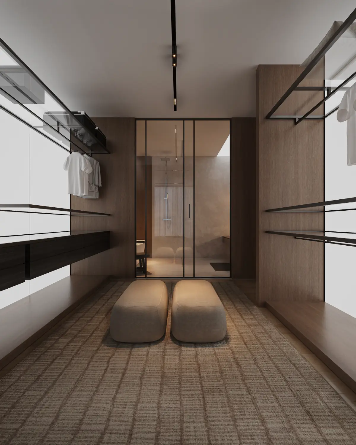 The Grid House walk-in closet with bathroom view render. Twin ottoman benches, glass partition revealing the en-suite shower beyond, walnut joinery, residential interior, Lahore.